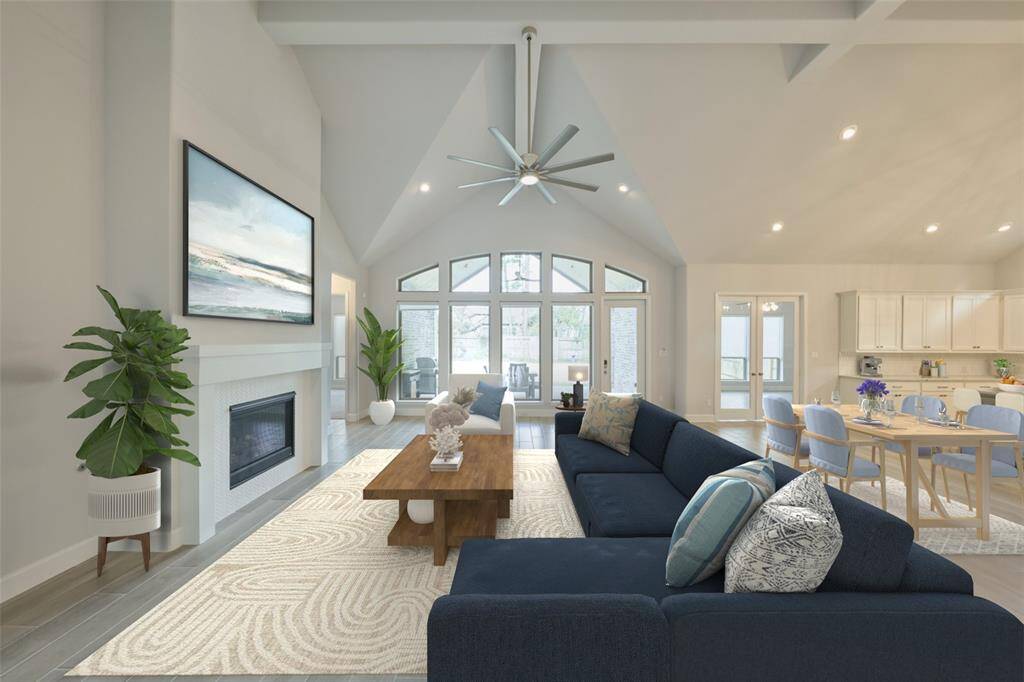 Expansive Open Conceptive Living Space. Enjoy an evening by the fire, next to this wall of windows, Connecting the Living Room, Covered Patio, Kitchen and Game Room. 136 Hushed Nightfall, The Woodlands Hills. Willis, TX. 77318.