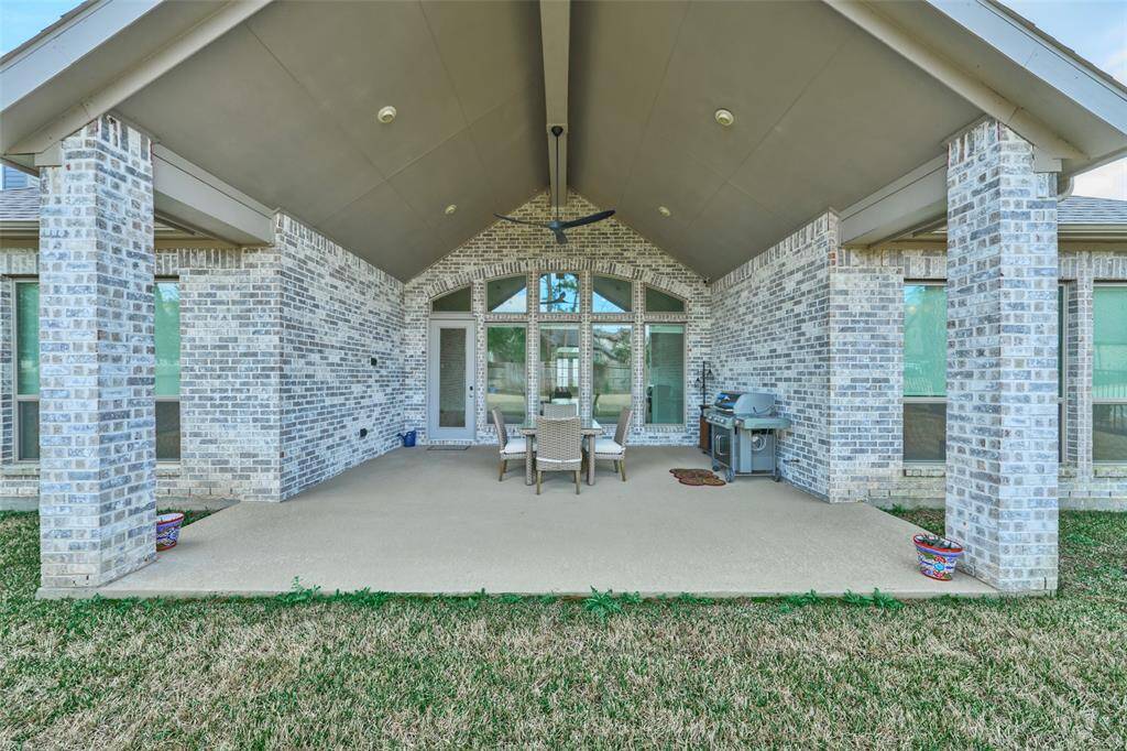 Installed gas grill conveys with accepted contract.  Enjoy ALL weather under this protected covered patio at 136 Hushed Nightfall.