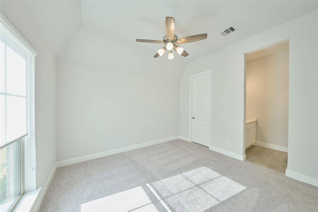 So much natural light in this Secondary Bedroom. Schedule your tour today at 136 Hushed Nightfall, The Woodlands Hills, Willis, Tx