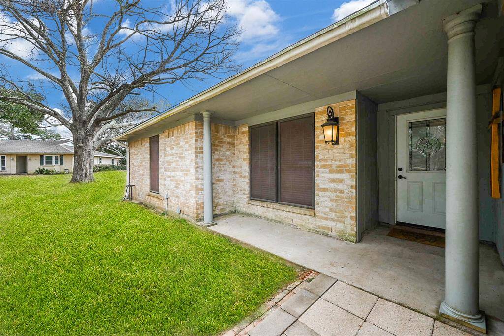 Covered Front Entry. There's Room for a Seating Area.