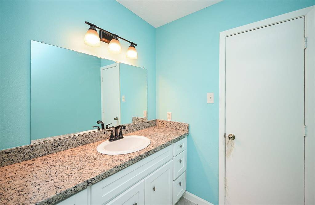 Full Hall Bath with a Separate Tub/Shower and Toilet Area.