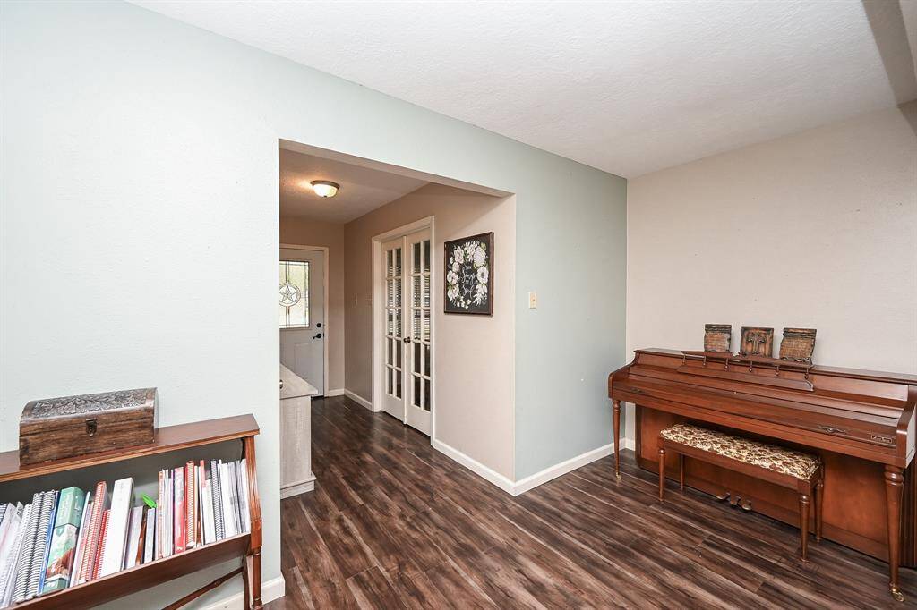 View of the approx. 11x5 Entry. The Double French Doors lead to the approx. 14x9 Home Office (Flex Room) which could be a 4th Bedroom, Dining Area, Play Room, Game Room, etc. Partial View of the Living Area.