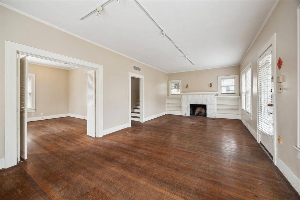 Another view of large living and a dining room from the left.