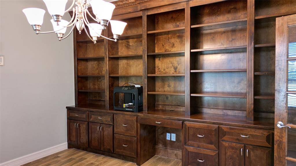 Custom wood mill work in your home office/study. French door access.
