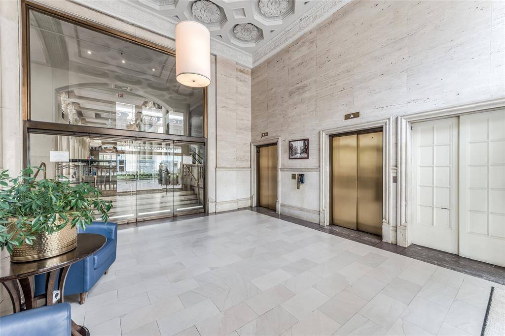This beautiful lobby greets you as well as your guests. Note The Corinthian through the glass doors - a popular venue for the most glamourous of occasions!