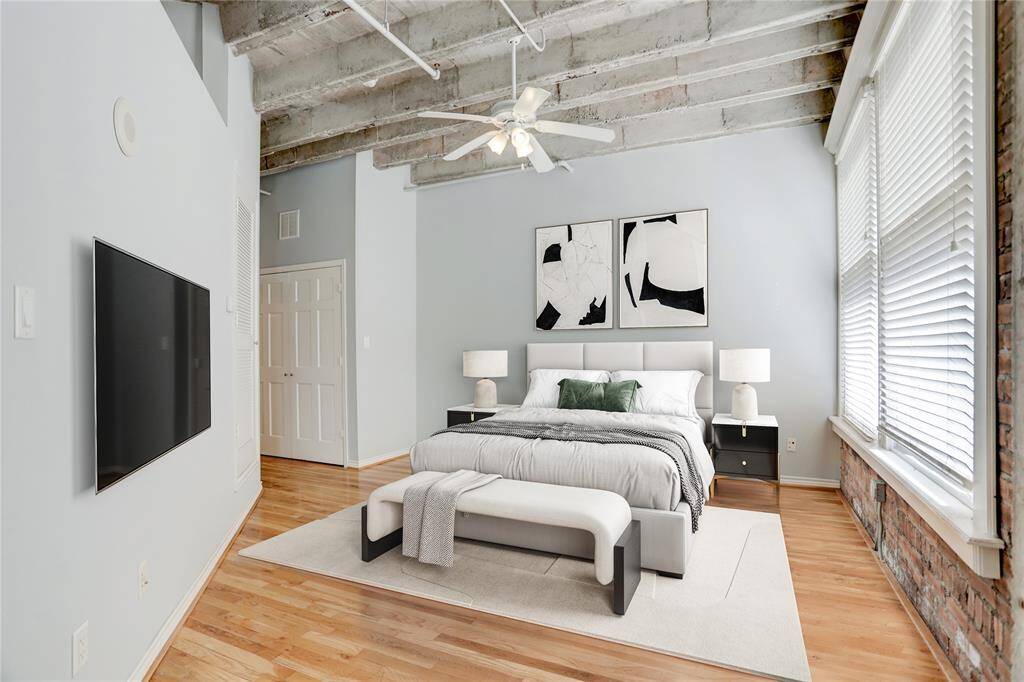 This spacious bedroom provides ample room for larger furniture pieces and artwork, creating an inviting and open feel. The layout allows for easy movement throughout the space, highlighting its airy and expansive nature. This photo is virtually staged.