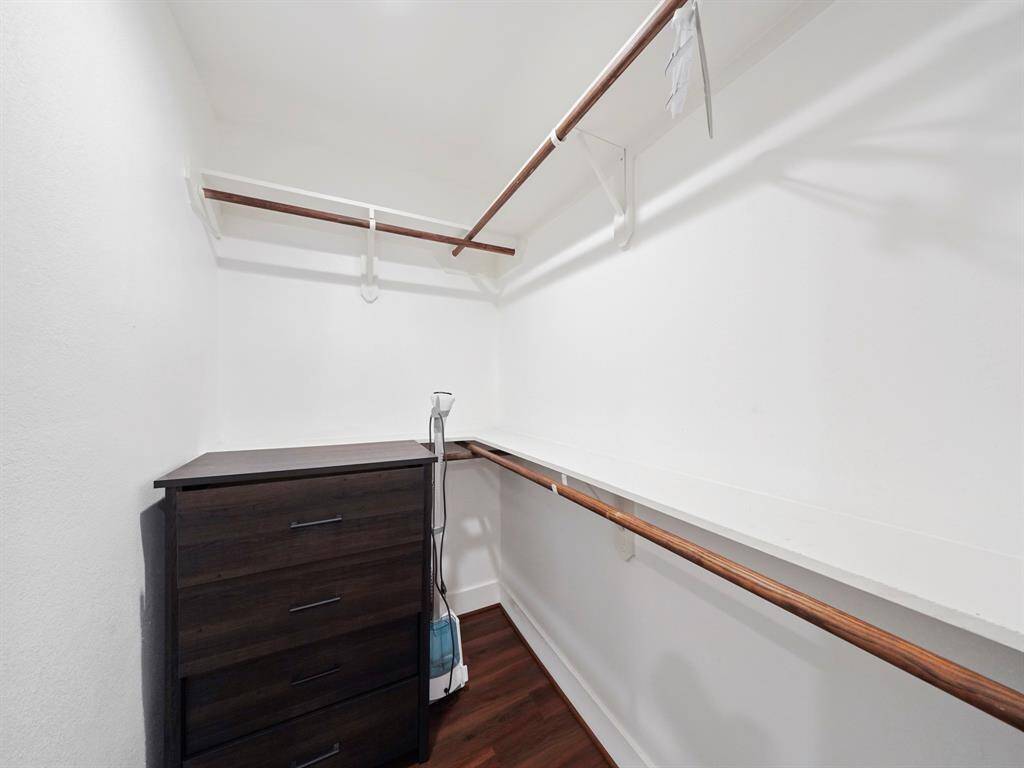 Primary bedroom spacious walk-in closet.
