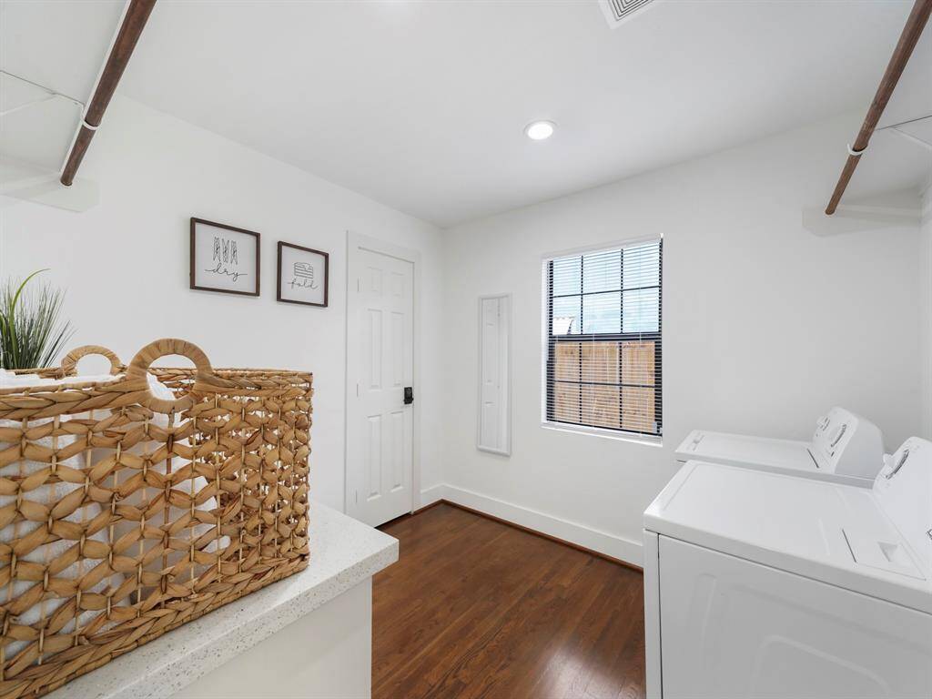The utility room provides ample space for all your laundry needs.