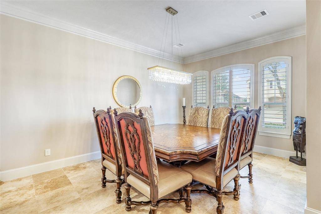 Formal dining room perfect for hosting gatherings.