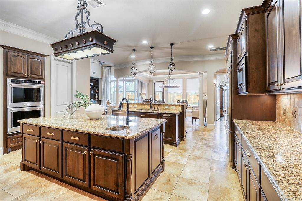 Expansive kitchen featuring double islands.