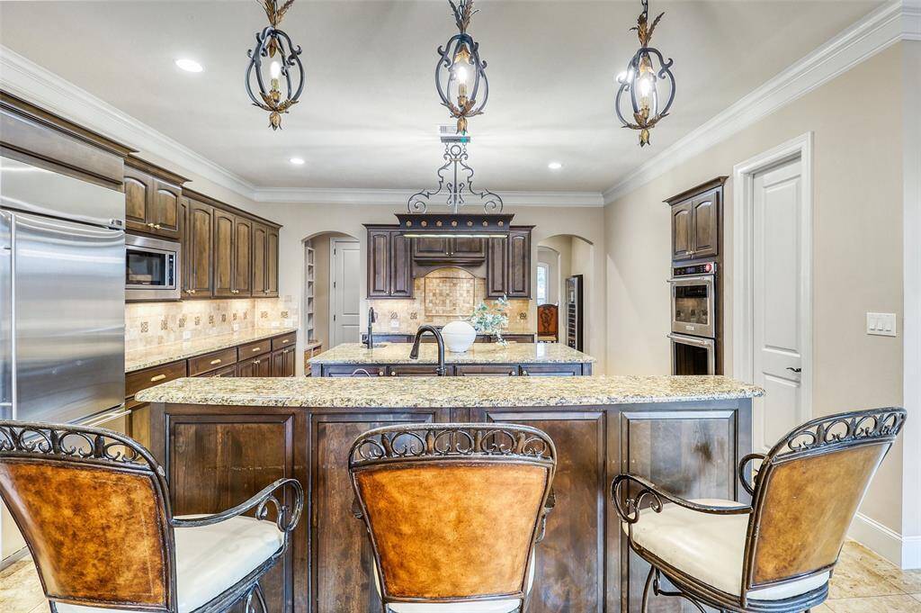 Expansive kitchen featuring double islands.