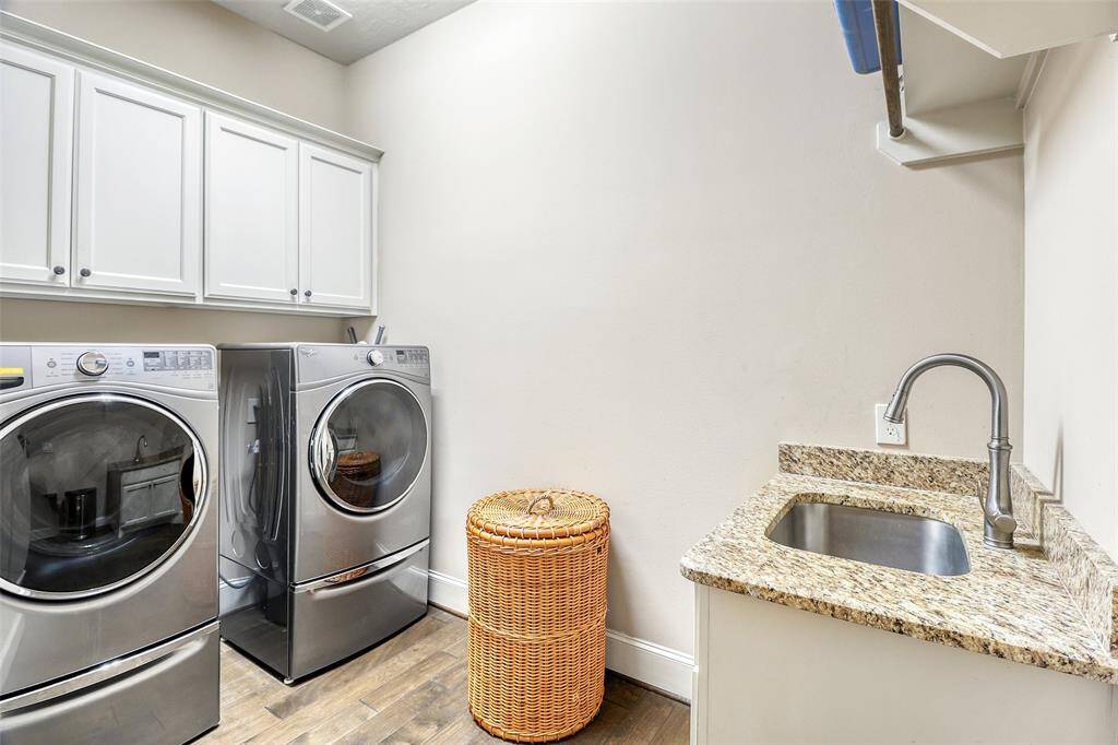 Laundry/utility room downstairs with sink.
