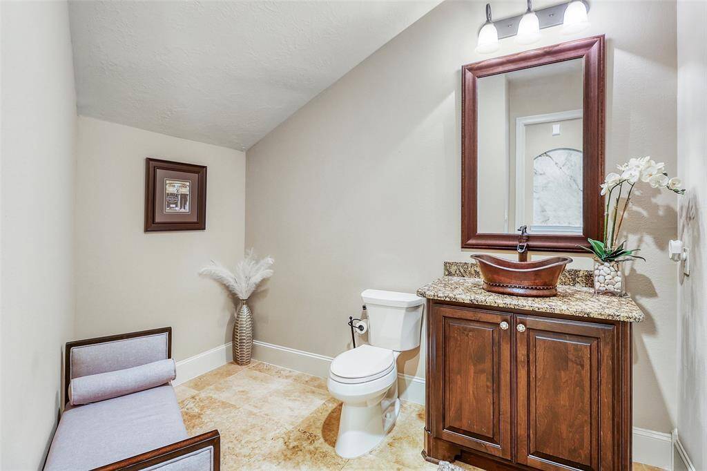 Spacious powder room downstairs ideal for guests.