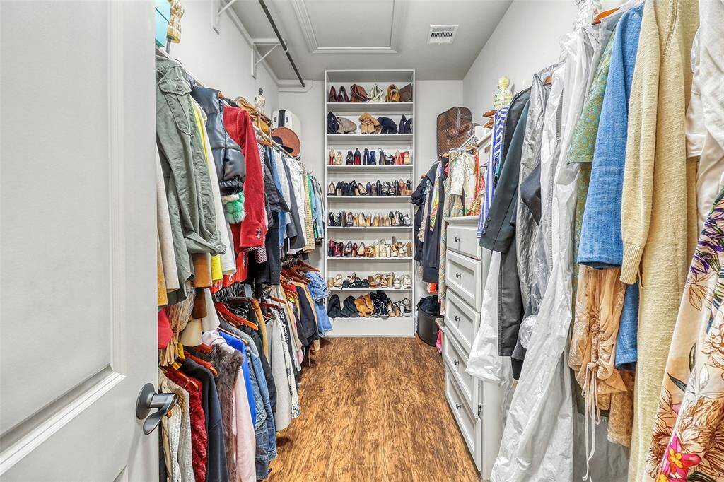 Her closet is spacious and thoughtfully designed for organization.