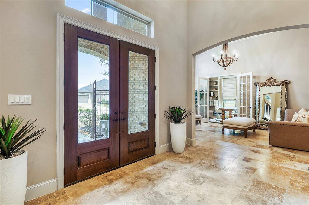 Elegant double front doors offering a grand entrance.