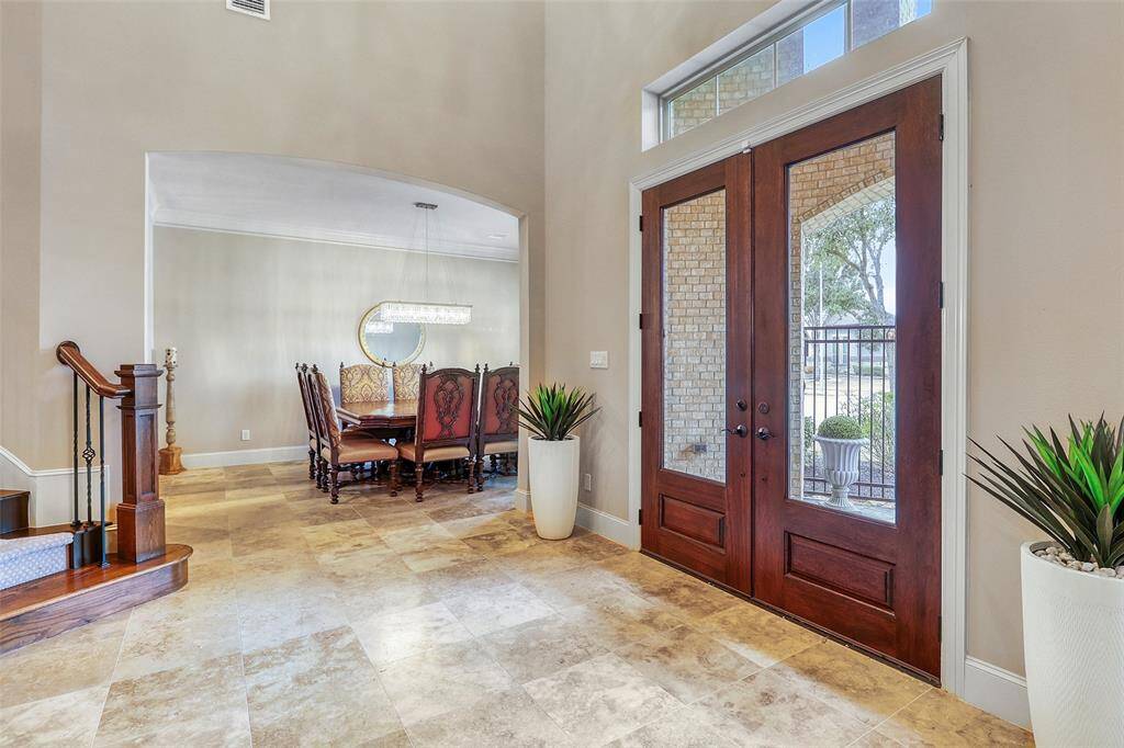 Elegant double front doors offering a grand entrance.
