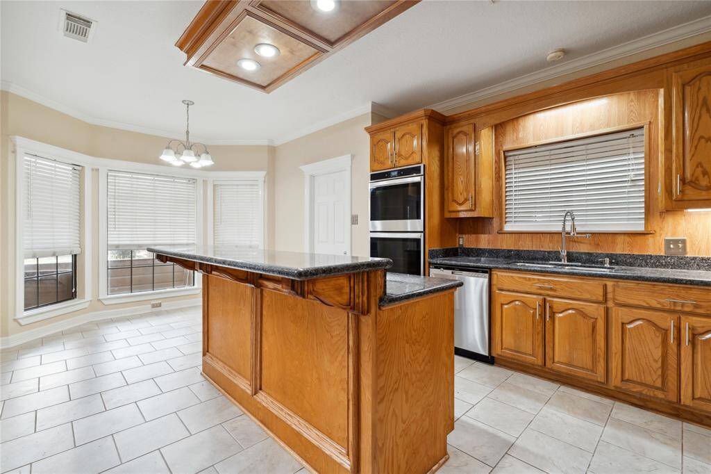 Careful detail in the cabinetry, beautiful trim work, and refrigerator stays!