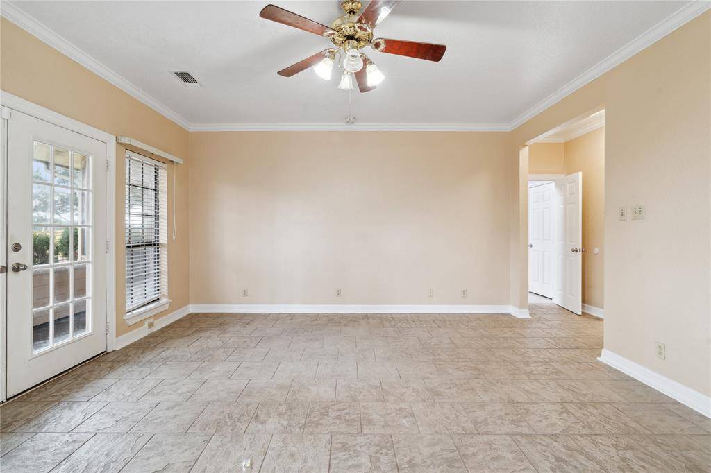 Great sized primary bedroom is downstairs with French doors to covered patio.