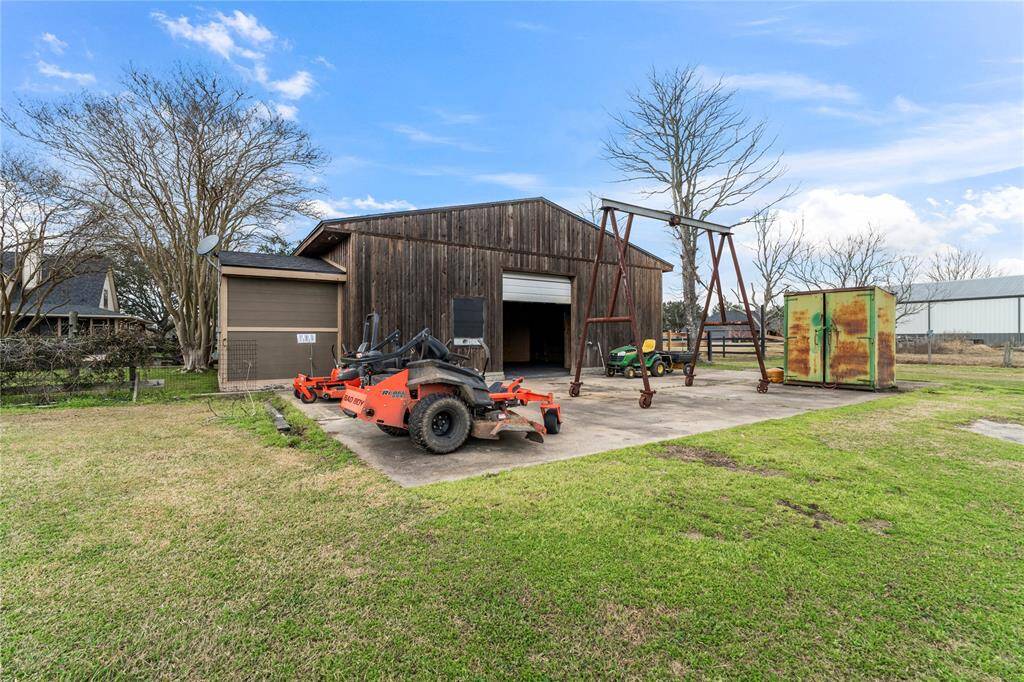 Barn with ample space and extended concrete padding. Shed stays.