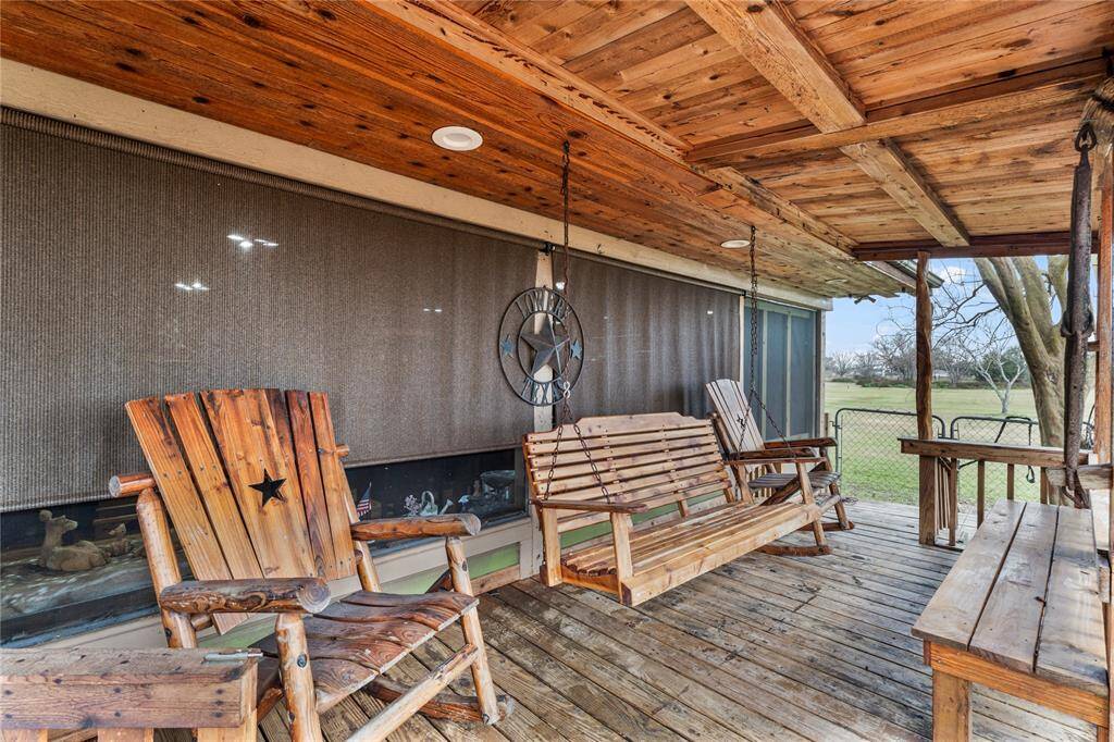 Covered porch with room for swinging, rocking and enjoying the gulf breezes from the south.