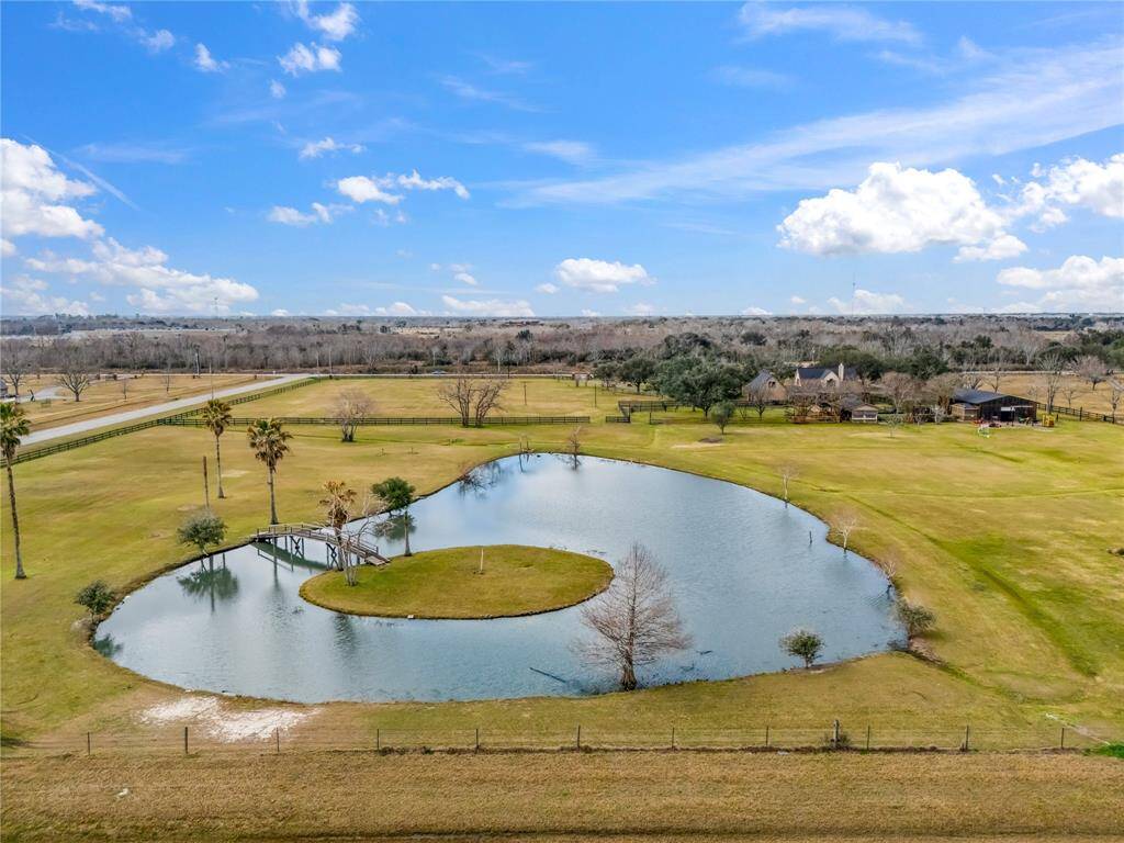 Bridge leads out to private island on this fully stocked bass pond. Also has a unique par 3 tee box for gold enthusiasts.