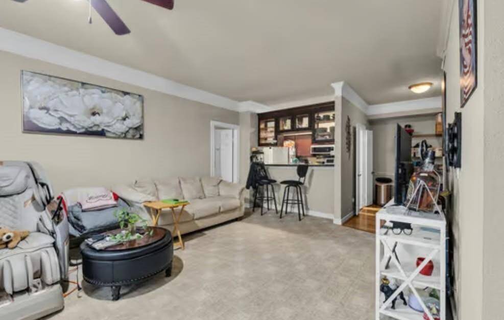 Spacious Patio off of the living room with a view of 2 covered parking spaces
