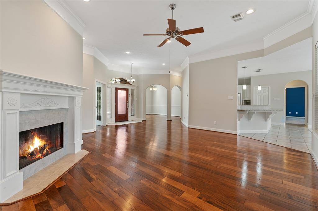 As you enter the front door, you're welcomed into a spacious living room.his generous space offers the perfect setting for both relaxed living and entertaining.