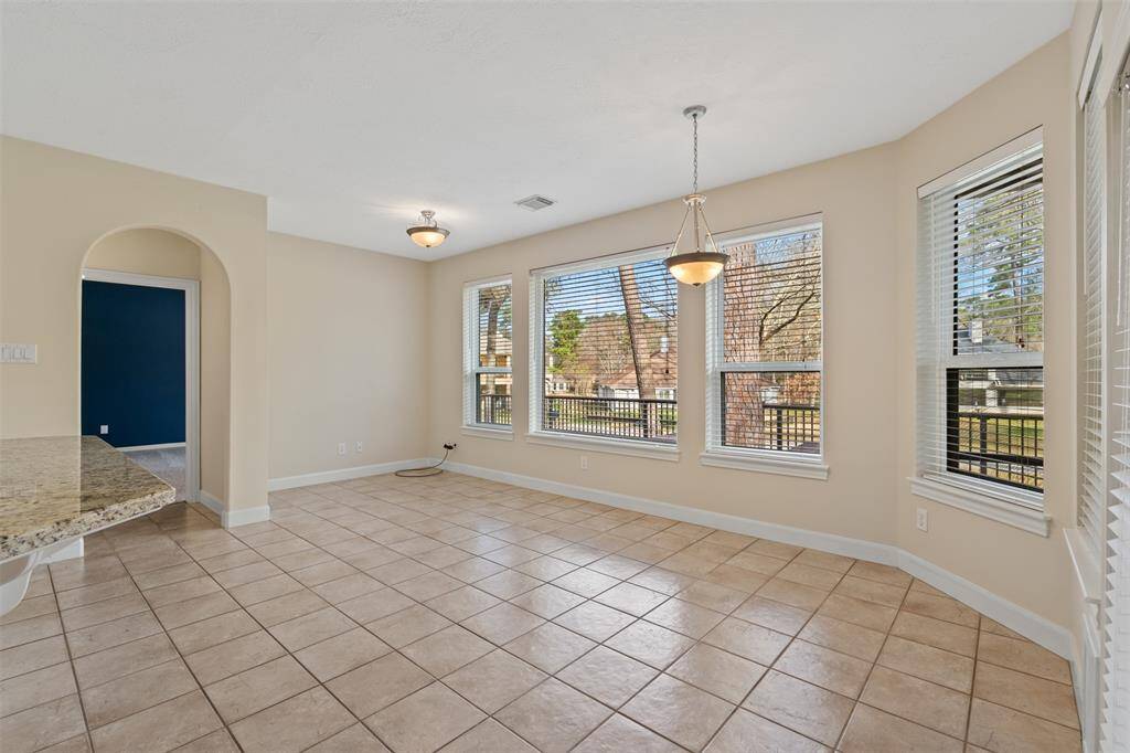 Adjacent to the kitchen is a large breakfast room that overlooks the golf course, offering the perfect spot to enjoy your morning coffee with a view