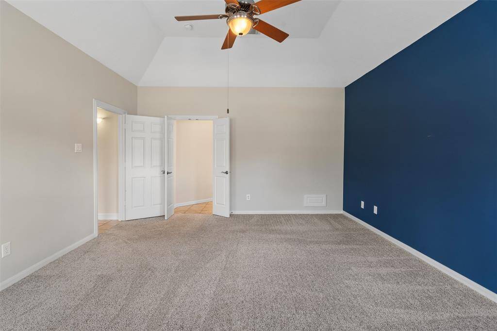 Another view of primary bedroom