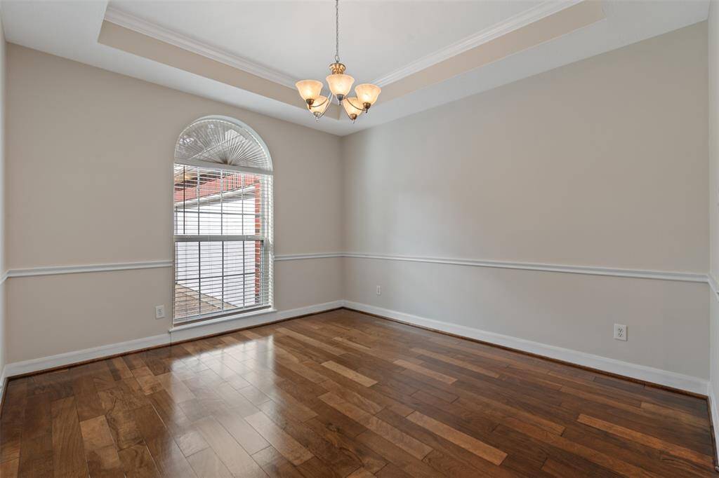 The new rich hardwood floors flow throughout the home, leading you to the spacious formal dining room, conveniently located right off the kitchen—ideal for hosting dinners and gatherings.