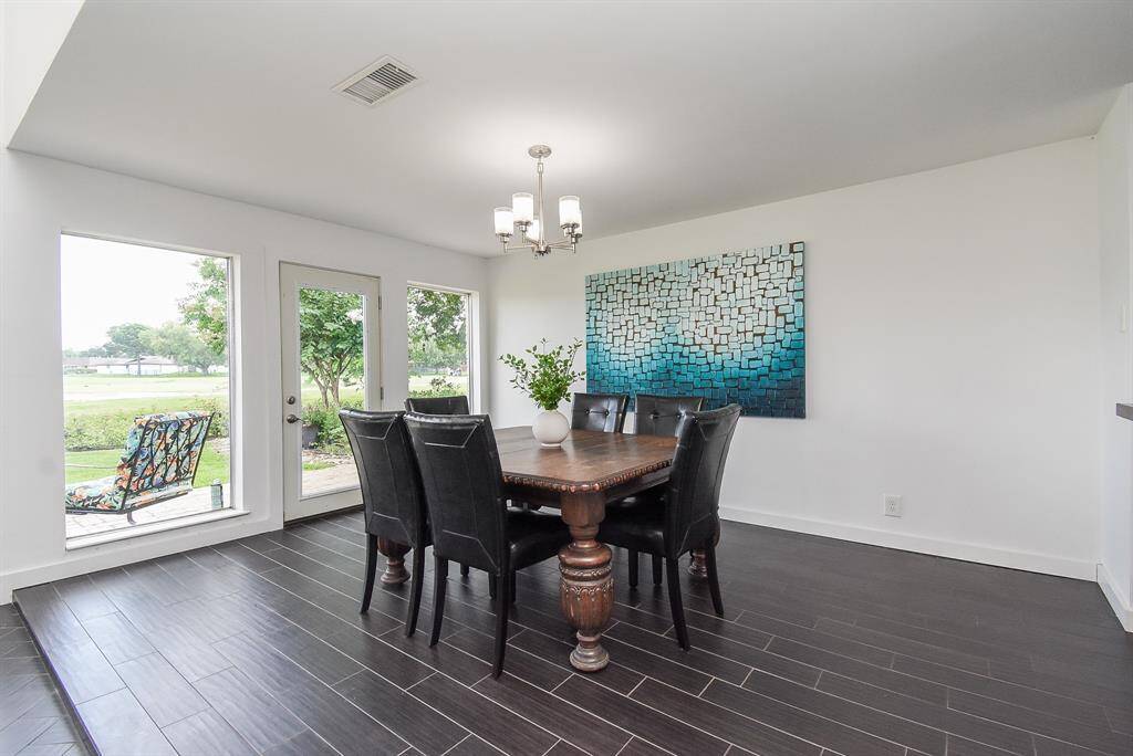 Formal Dining Room with door to back patio.  Large picture windows provide the mesmerizing views