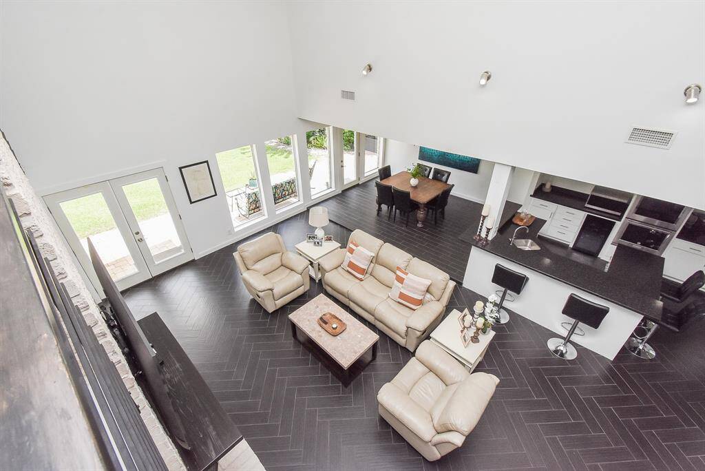 View from 2nd floor looking into living room, kitchen and dining room