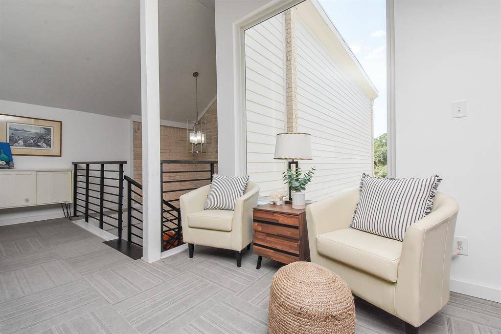 Another adorable sitting area upstairs with large window to let in the natural light.   I think this will be your new book nook