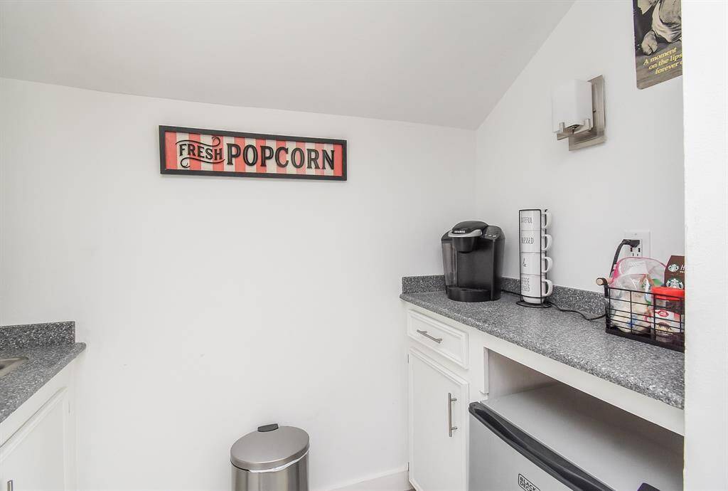 Upstairs nook with small refrigerator, coffee bar and sink on the left.  Perfect for movie night!