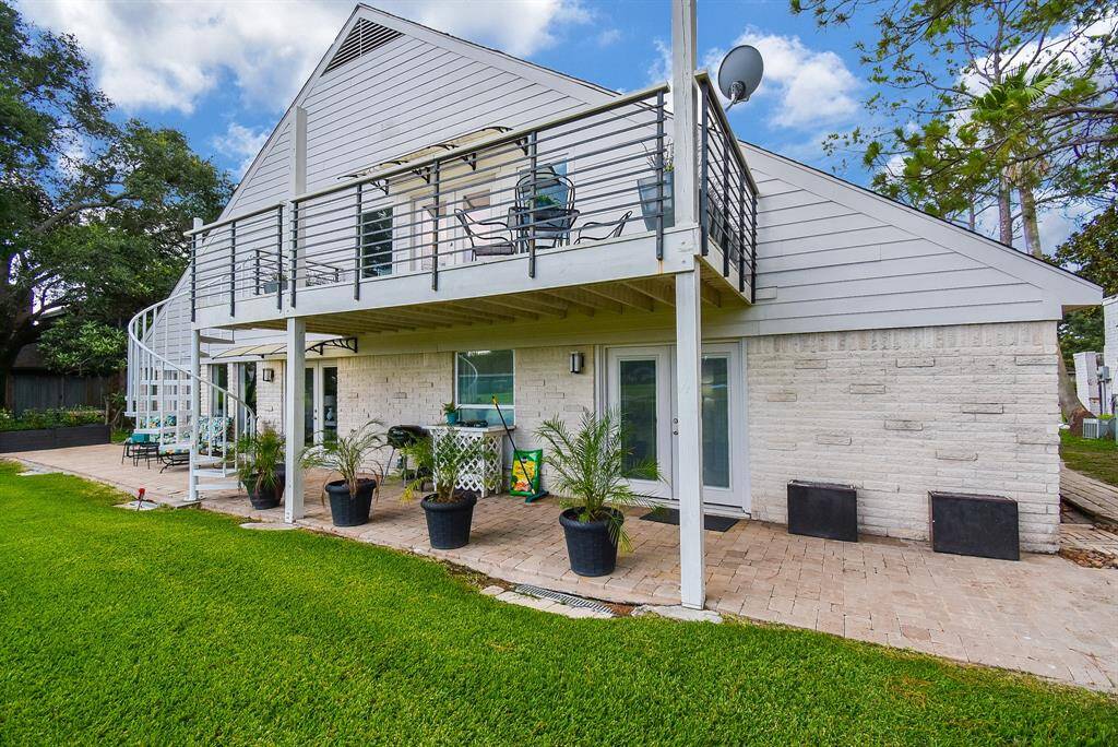 Great view of the upgraded Hardi siding, balcony and staircase