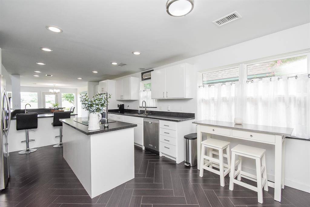 So many updates and features in this complete kitchen remodel including all new countertops, cabinets, fixtures and appliances