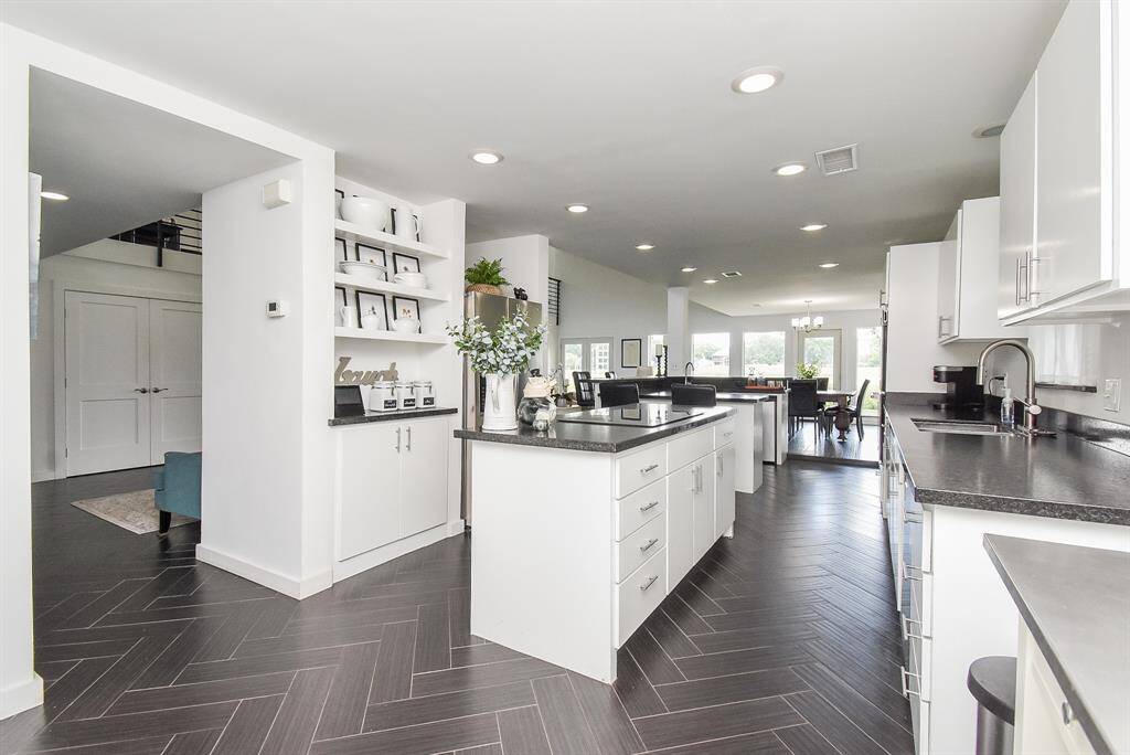Kitchen features tons of storage, LED light fixtures with 6,000K daylight white and those white cabinets we all love!