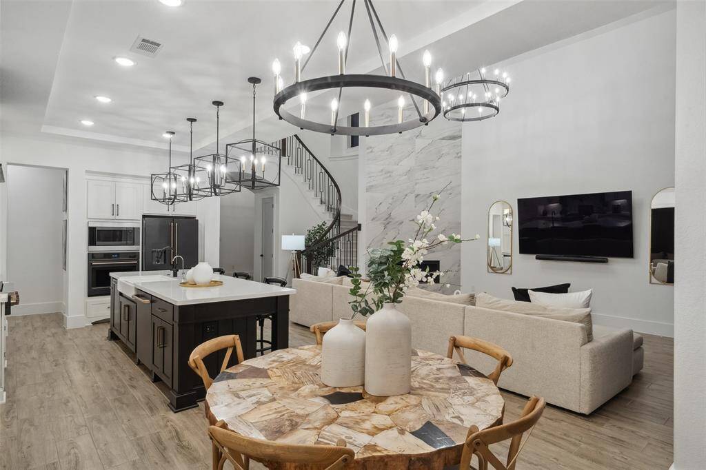 High end light fixtures and finishes are showcased throughout the home