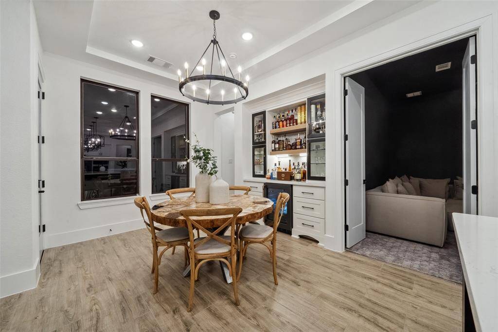 Media room located just off of the main living area perfect for hosting movie night