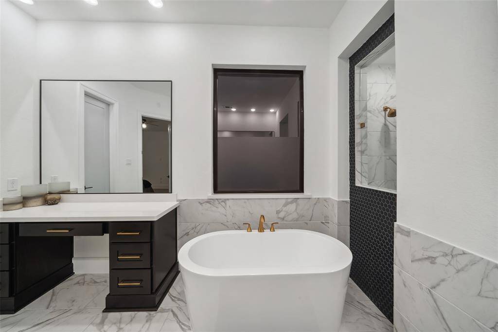 Refined, modern finishes and deep soaking tub offer the perfect blend of style and indulgence