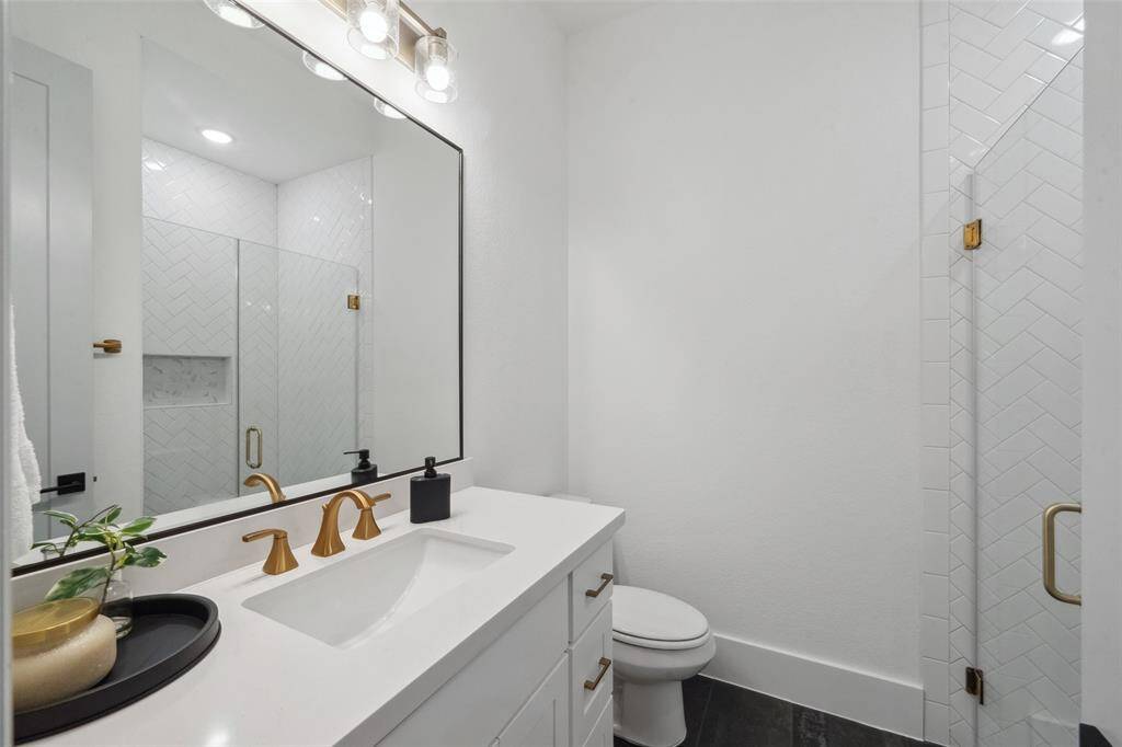 Bright and spacious full bathroom with walk-in shower