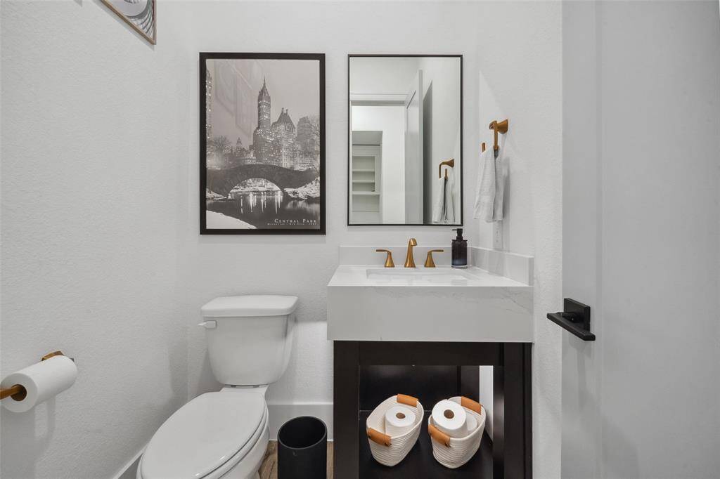 Modern, sleek designs continue to the half bathroom on the first floor