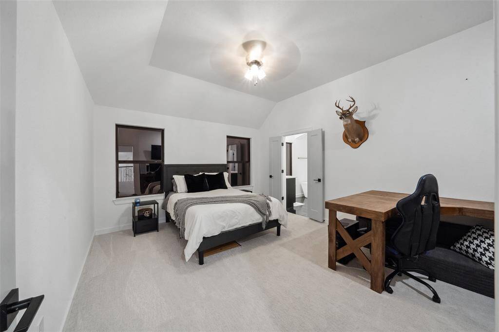 Located on the second floor, this additional owner's suite offers ideal retreat to relax and unwind
