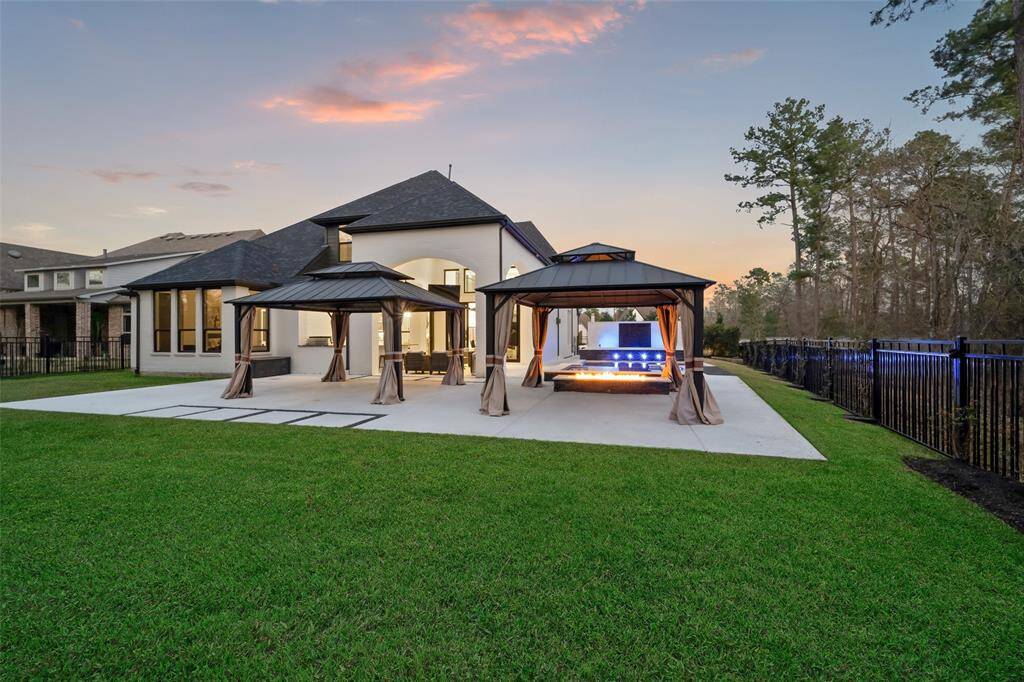 Mounted pergolas and fire pit create an outdoor space for all seasons