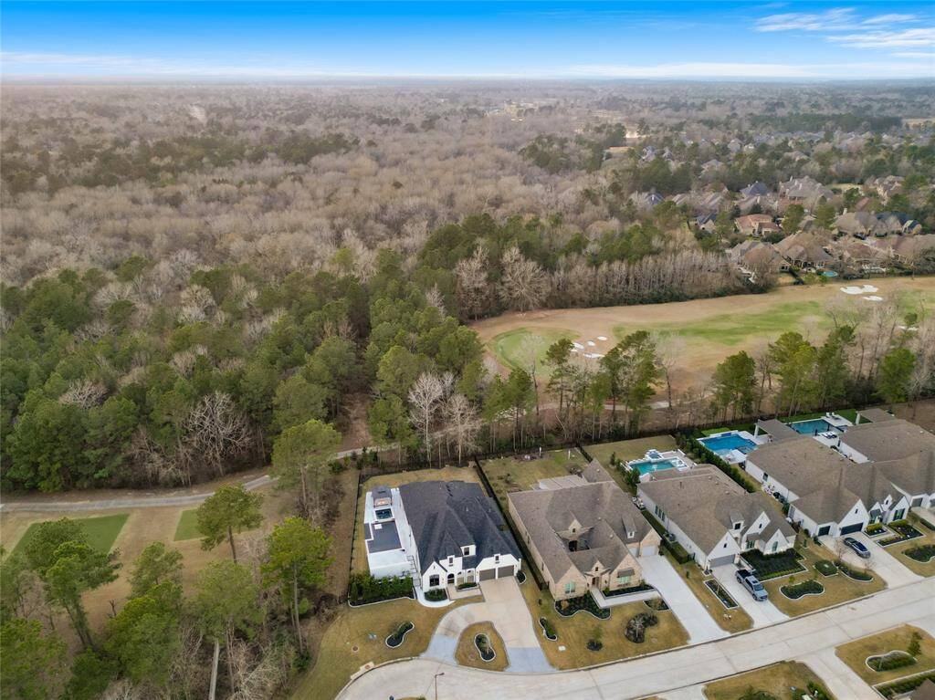 Prime, semi-secluded lot with circle drive and golf course surrounding two sides