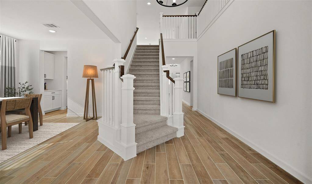 Welcoming foyer with grand staircase  (*Photo not of actual home and used for illustration purposes only.)