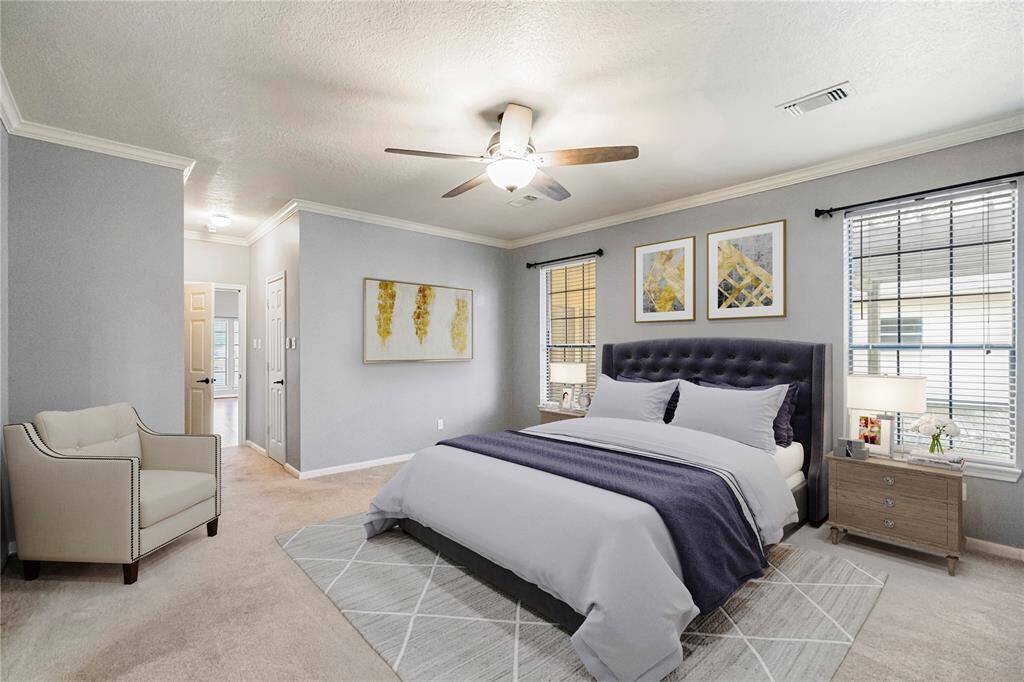 *Virtually Staged* Primary bedroom with his and her closets and plenty of natural lighting