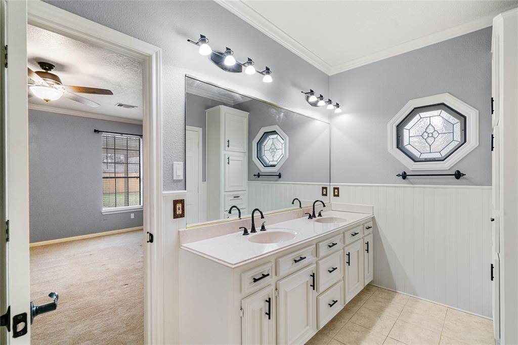 Primary bathroom with updated paint and fixtures