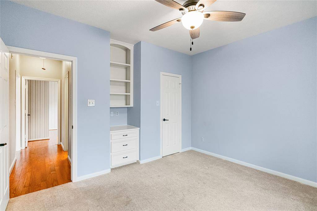 Bedroom with built in cabinet and drawers