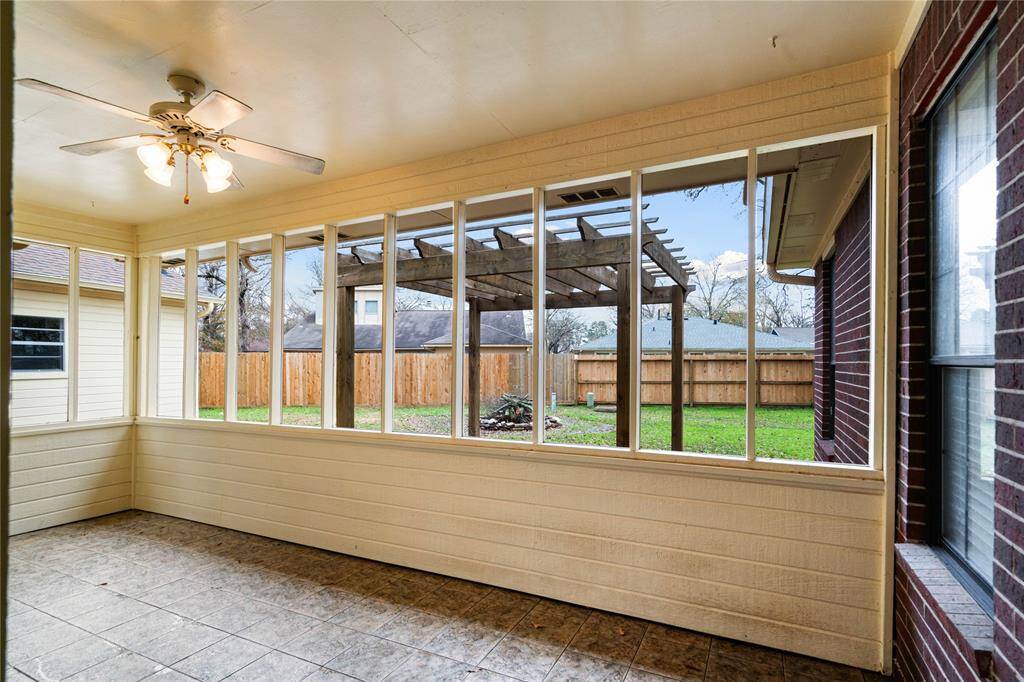 Space that can be utilized for a sunroom or enclosed back patio